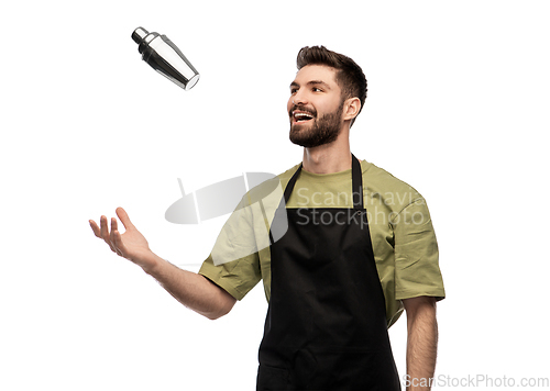 Image of happy barman with shaker preparing