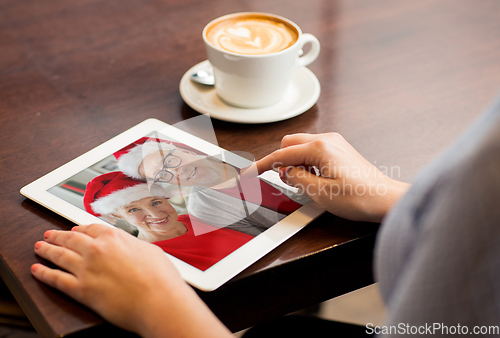 Image of close up of woman with tablet pc having video call