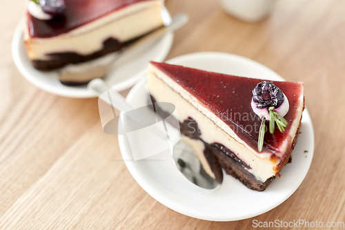 Image of piece of chocolate cake on wooden table