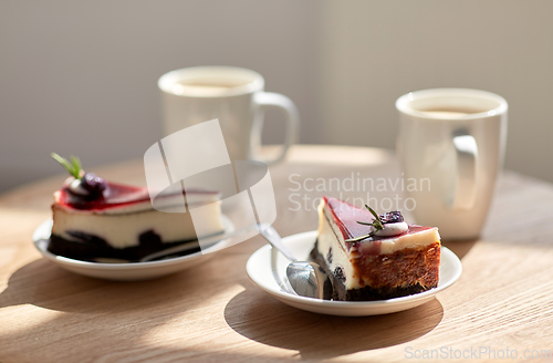 Image of pieces of chocolate cake on wooden table