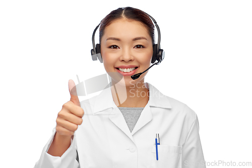 Image of smiling asian female doctor or nurse in headset