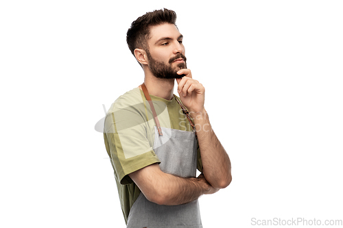 Image of thinking barman in apron