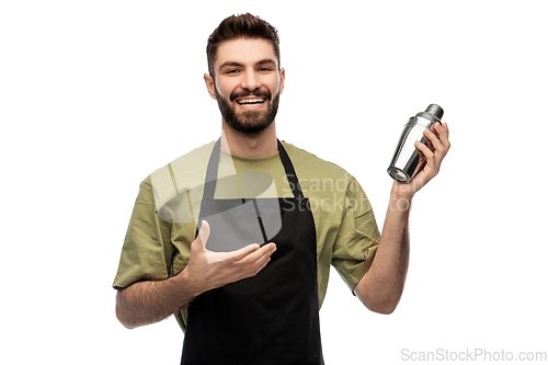 Image of happy barman with shaker preparing