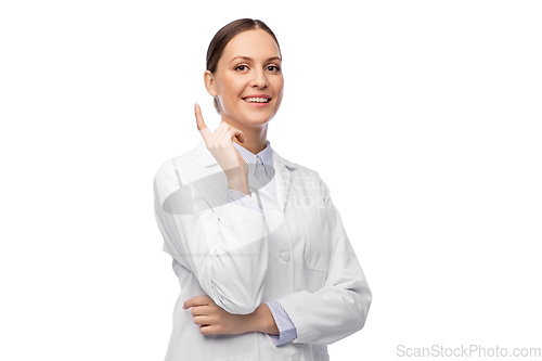Image of happy female doctor pointing finger up