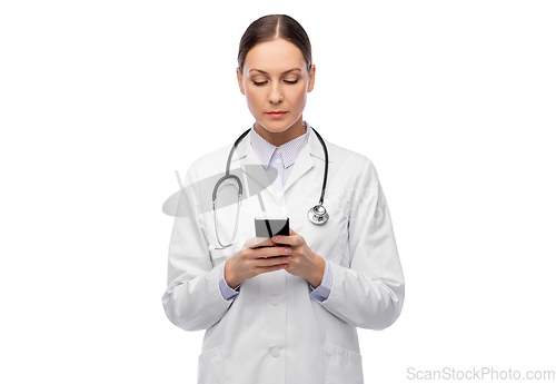 Image of female doctor with stethoscope using smartphone
