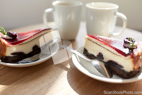 Image of piece of chocolate cake on wooden table