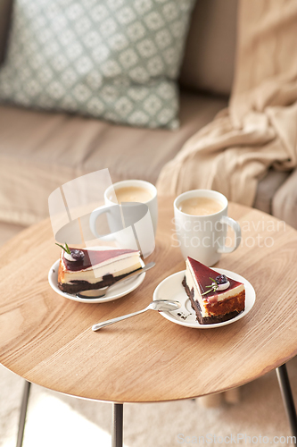 Image of pieces of chocolate cake on wooden table