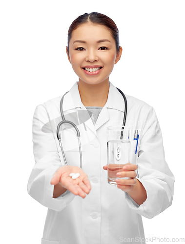 Image of asian doctor with medicine and glass of water