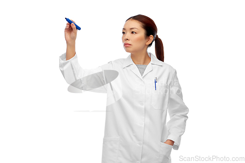 Image of asian female doctor writing with blue marker