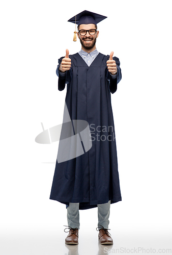 Image of happy male graduate student showing thumbs up