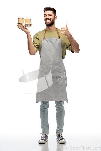 Image of happy waiter with takeout coffee showing thumbs up