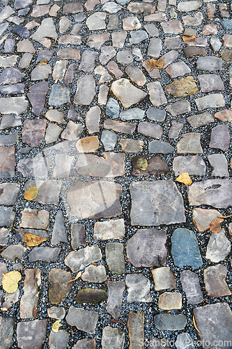 Image of Old pavement of stones of different colors and sizes