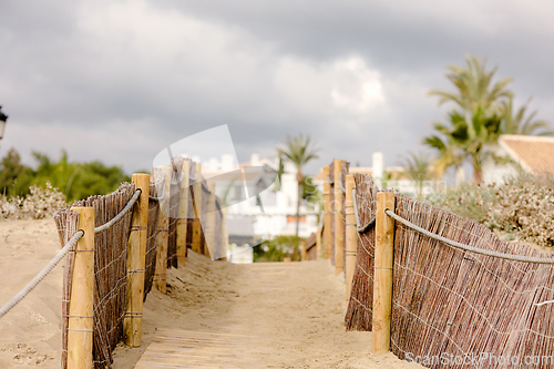 Image of backyard gate to Marbella beach