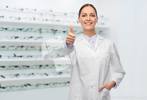 Image of female doctor showing thumbs up at optical store