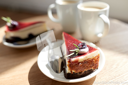 Image of piece of chocolate cake on wooden table