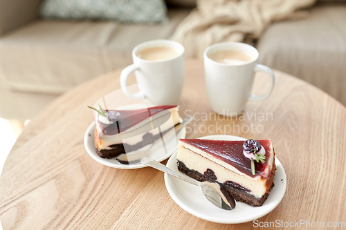 Image of pieces of chocolate cake on wooden table