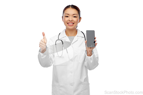 Image of asian doctor with smartphone showing thumbs up