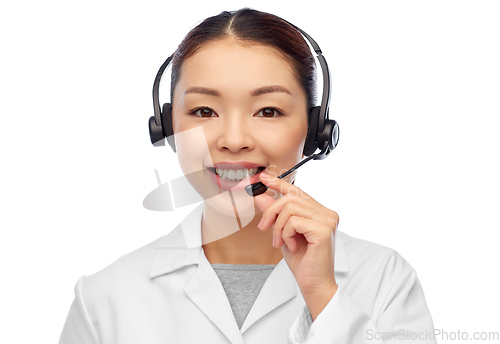 Image of smiling asian female doctor or nurse in headset