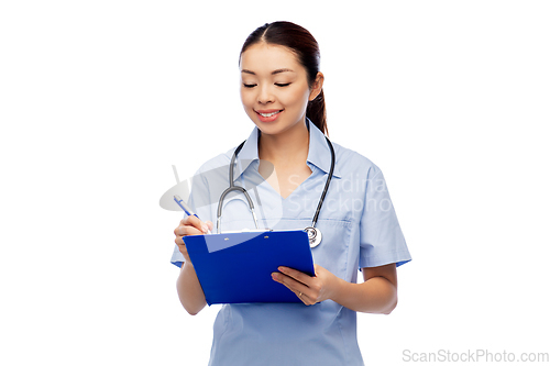 Image of happy smiling asian female doctor with clipboard