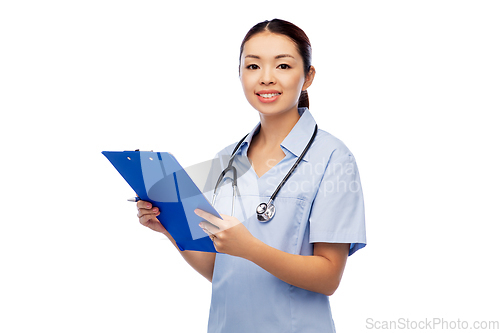 Image of happy smiling asian female doctor with clipboard