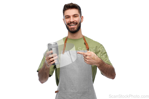 Image of happy waiter with tumbler or takeaway thermo cup