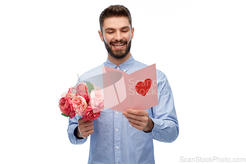 Image of happy man with flowers and valentine's day card