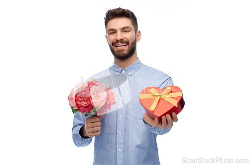 Image of happy man with flowers and valentine's day gift