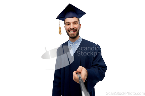 Image of male graduate student taking selfie with monopod