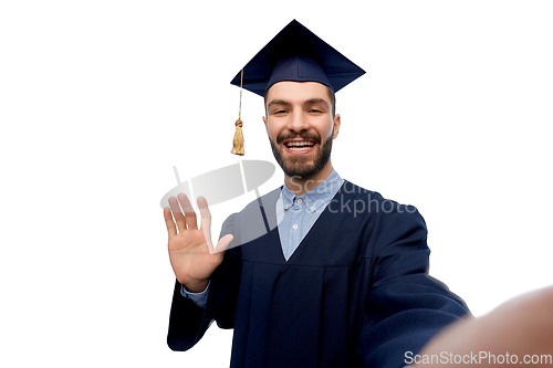 Image of smiling male graduate student taking selfie