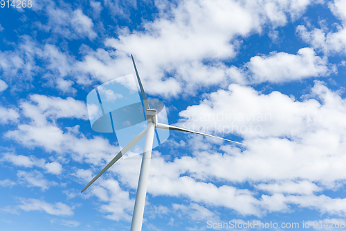 Image of Wind turbine with blue sky