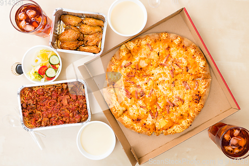 Image of Top view of eating pizza take away