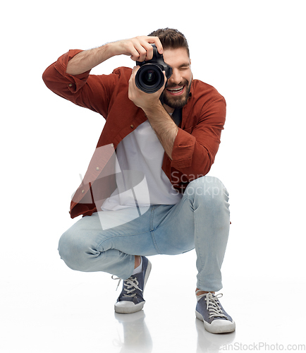 Image of smiling man or photographer with digital camera