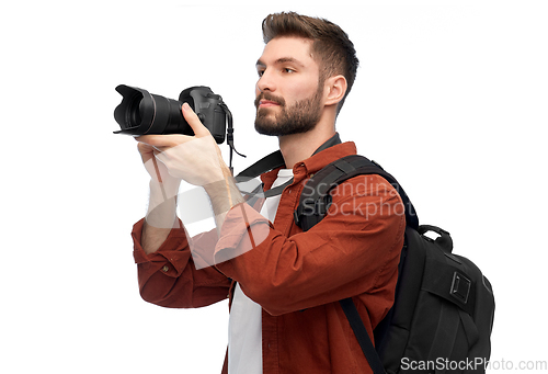 Image of man or photographer with camera and backpack