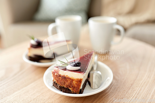 Image of piece of chocolate cake on wooden table