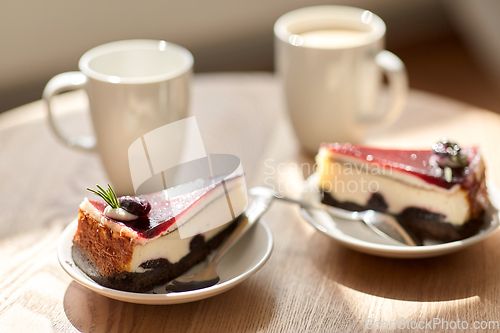 Image of piece of chocolate cake on wooden table