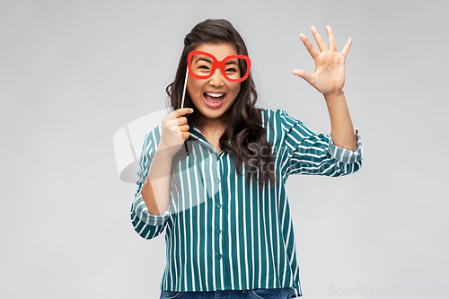 Image of happy asian woman with big party glasses