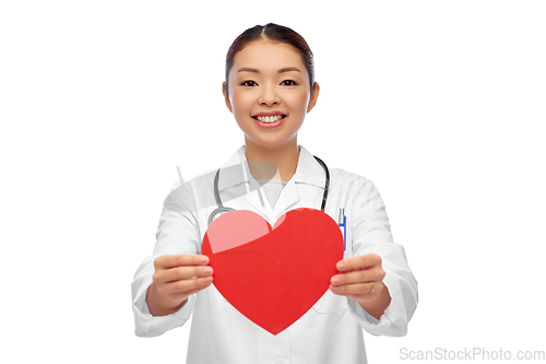 Image of happy smiling asian female doctor with red heart