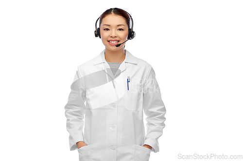 Image of smiling asian female doctor or nurse in headset