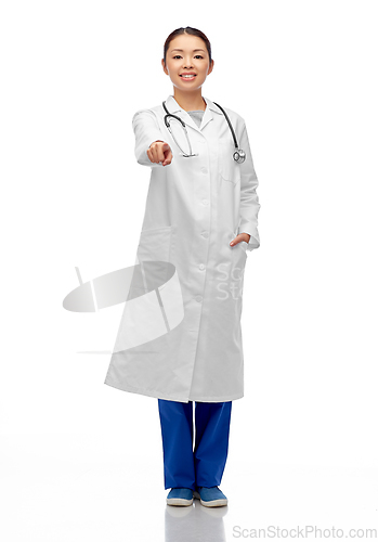 Image of happy asian female doctor pointing to camera