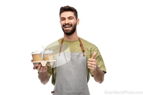 Image of happy waiter with takeout coffee showing thumbs up