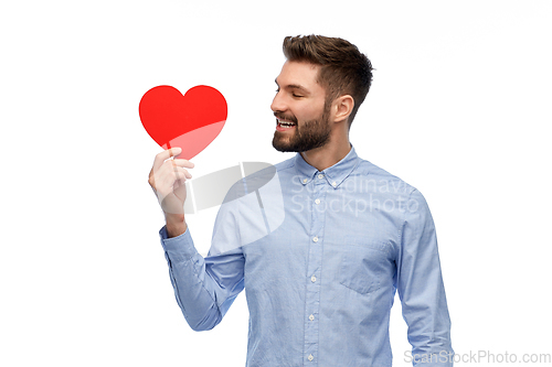 Image of happy smiling young man with red heart