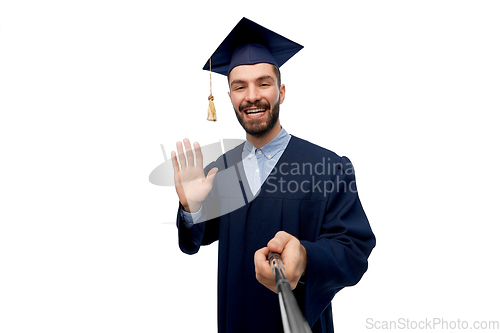 Image of male graduate student taking selfie with monopod