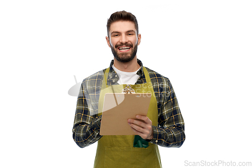 Image of happy male gardener with clipboard