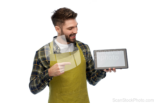 Image of happy male gardener or farmer with tablet pc