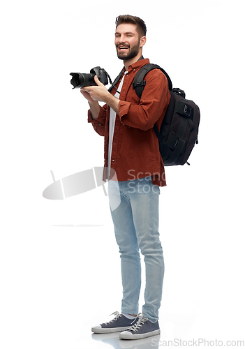Image of happy man or photographer with camera and backpack