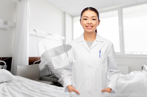 Image of happy smiling asian female doctor at hospital