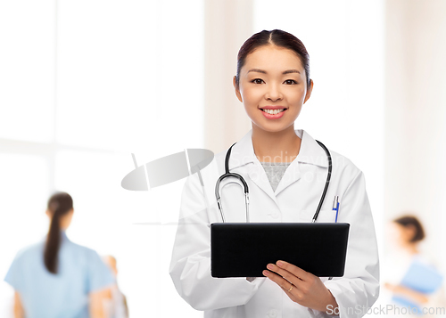 Image of asian female doctor with tablet pc at hospital