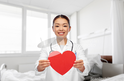 Image of asian female doctor with red heart at hospital