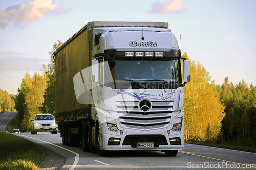 Image of White Mercedes-Benz Actros Pulls DHL Trailer