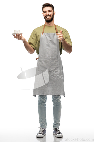 Image of barista or waiter with coffee showing thumbs up